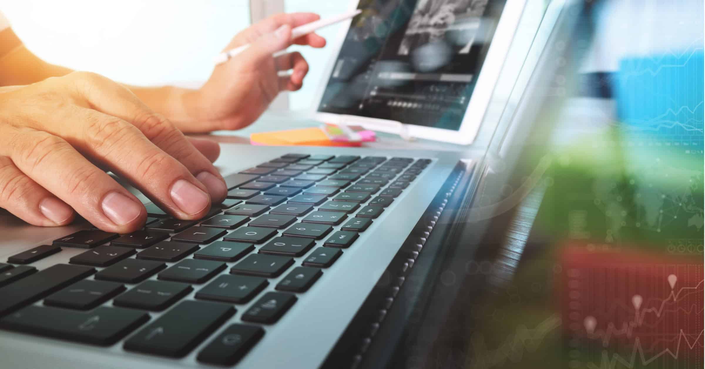 Person working on a laptop brainstorming website architecture.